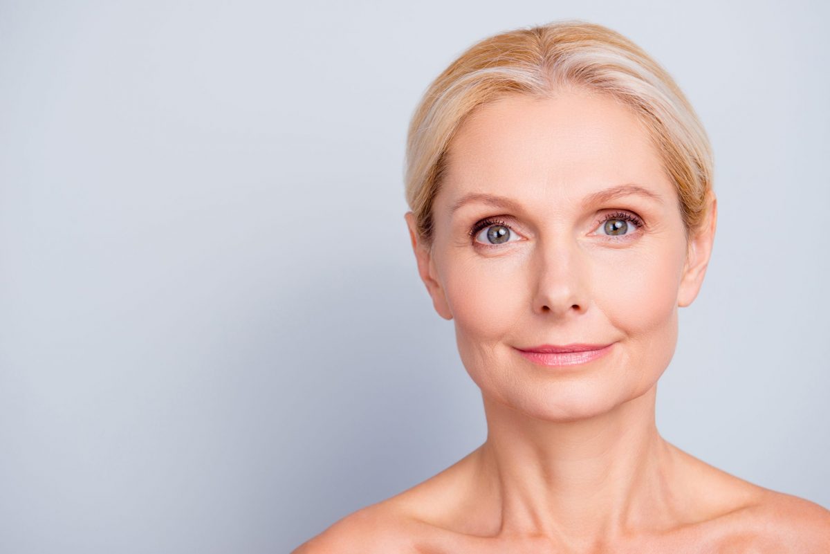 A middle aged woman with youthful skin free of wrinkles